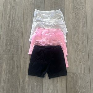 Jumping Beans shorts. 2 white, 2 pink, 1 black. Size 6.